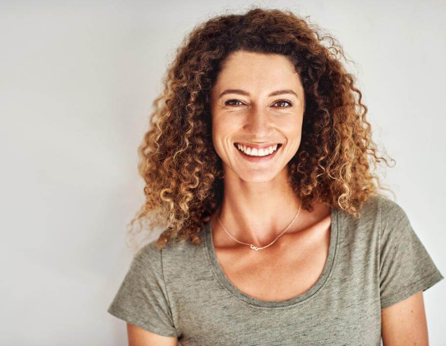 woman smiling after having consultation with dr naz in liverpool