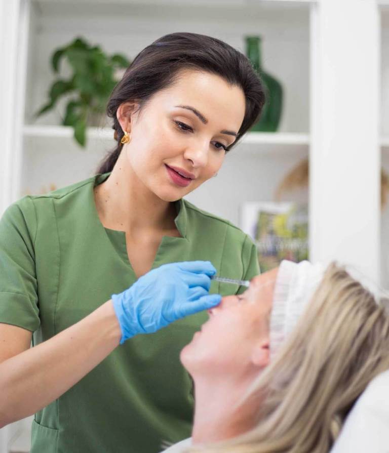 Dr Naz during an aesthetics treatment