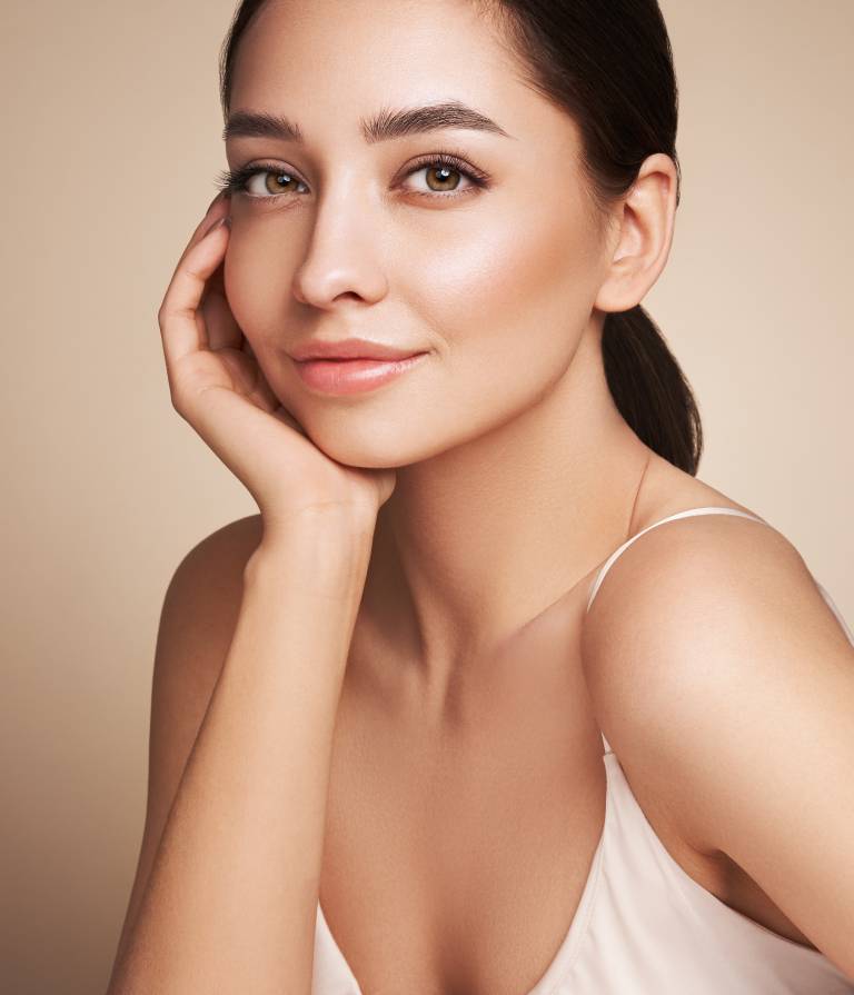 woman smiling after dermal fillers